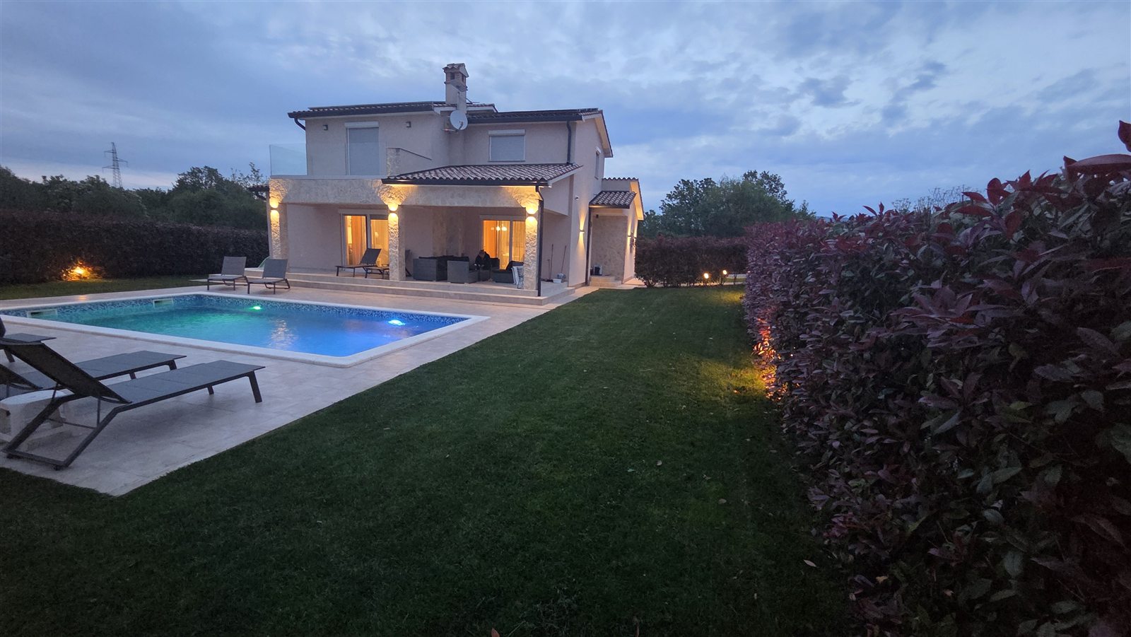 Casa Copa and its private pool, framed by the garden at dusk