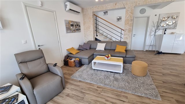 Living room with stone wall